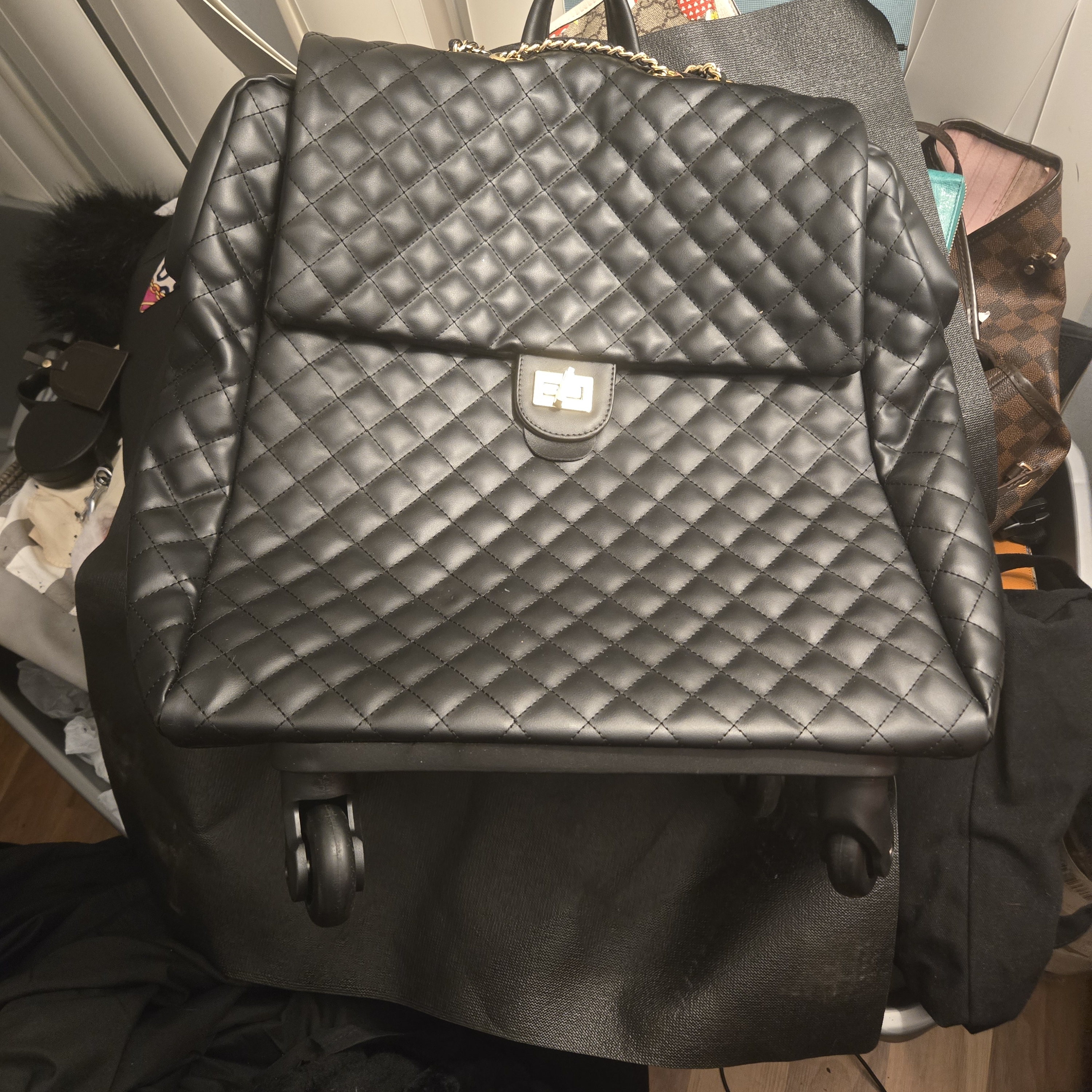 Black Quilted Backpack With Gold Chain